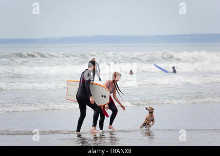 Gower, Swansea, Wales, UK. 1st June 2019. Weather:  Beachgoers enjoyed a warm day with some cloud and spells of hazy sunshine at Llangennith beach on the Gower peninsula, near Swansea, South Wales. Cloud is forecast to build overnight with rain for tomorrow. Credit: Gareth Llewelyn/Alamy Stock Photo