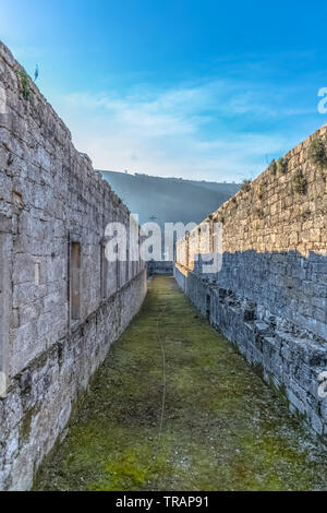 Tarouca / Portugal - 03 15 2018: View of historic building in ruins, inside convent of St. Joao of Tarouca, detail of ruined walls corridor with spans Stock Photo
