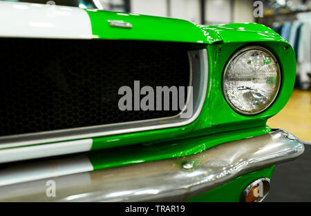 Sankt-Petersburg, Russia, July 21, 2017: Front view of Green Classic retro Ford Mustang GT. Car exterior details. Headlight of a retro car. Stock Photo
