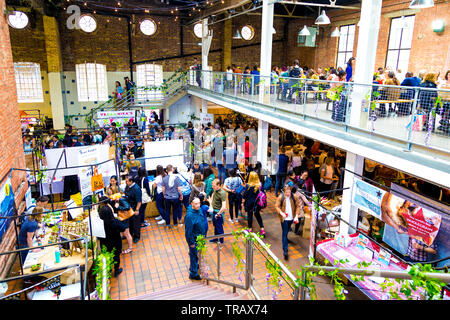 27th May 2019 - People visiting the Free From Festival for gluten-free and low sugar products, Boiler House, Brick Lane, London, UK Stock Photo