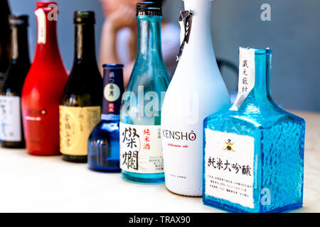 A selection of empty sake bottles Stock Photo