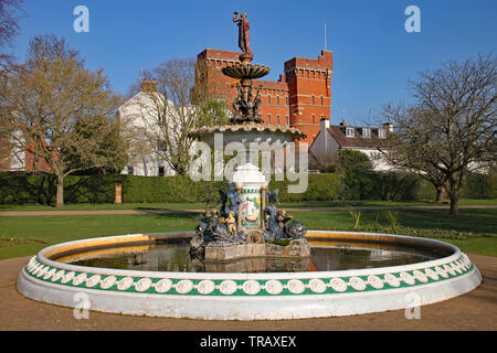 The ornate fountain in Vivary Park, Taunton on a beautiful spring day. Jellalabad barracks is in the background. Stock Photo