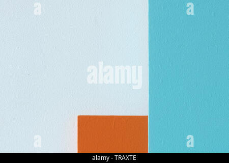 Close up abstract image of white, orange and light blue painted wooden panels Stock Photo