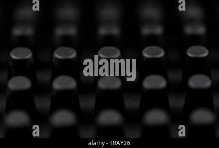 Macro image of the nodules of a black rubber coin mat Stock Photo