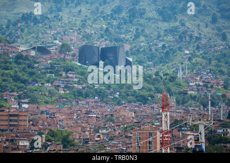 Santo Domingo Savio neighborhood in Medellin; the Spain Library Park is seen in the distance Stock Photo