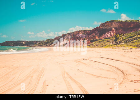 Leading sand tracks tyre trail on a beach in Conde,Paraiba, Brazil Stock Photo