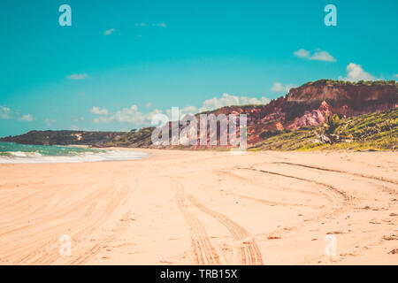 Leading sand tracks tyre trail on a beach in Conde,Paraiba, Brazil Stock Photo