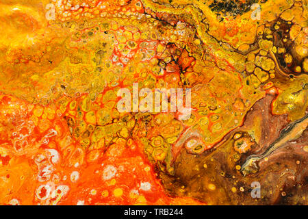 photography of abstract marbleized effect background. red and orange creative colors Stock Photo