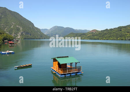 Small wooden house floating on Drina river Serbia Stock Photo