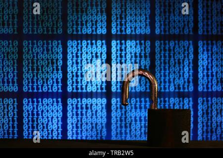 opened padlock in front of binary code blocks background. cyberspace computer security breached. internet hacker cyber war reached privacy data server Stock Photo
