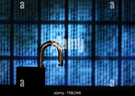 opened padlock in front of binary code blocks background. cyberspace computer security breached. internet hacker cyber war reached privacy data server Stock Photo