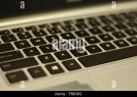 Abstract view of qwerty keyboard in an office setup Stock Photo