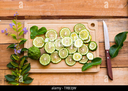 background texture nature kaffir lime slice arrangement  flat lay style on block chopping Stock Photo