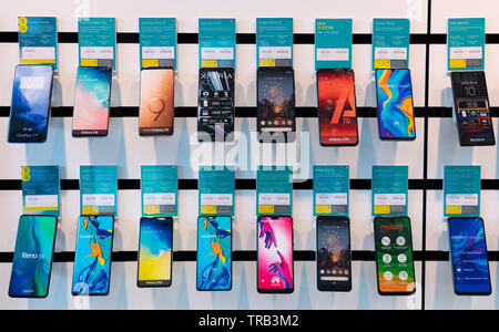 Rows of new smart phones on display in EE mobile phone shop Stock Photo