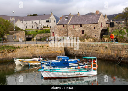 Northern Ireland, Co Down, Annalong, leisure boats moored in harbour by water mill Stock Photo