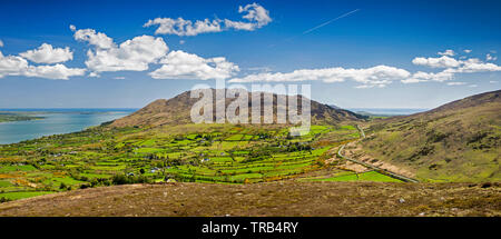 Ireland, Co Louth, Cooley Peninsula, Black Mountain, rocky landscape towards Carlingford Mountain, with road crossing Windy Gap, panoramic Stock Photo