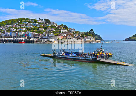 The Dartmouth Lower Ferry leaves Dartmouth,crossing the tidal river Dart towards Kingswear.This is a pontoon ferry that is pushed/pulled by a tug boat Stock Photo