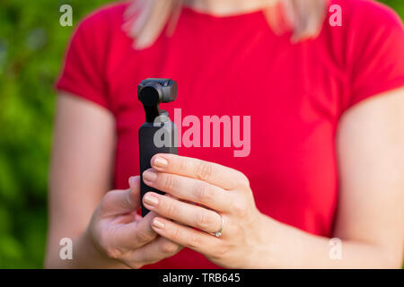 Close up picture of osmo camera in female hands Stock Photo