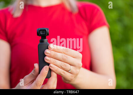 Close up picture of osmo camera in female hands Stock Photo