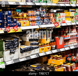 MILAN, ITALY - 2 JUNE, 2018: Grocery shelves interior of the popular in Italy grocery Penny Market Express. Stock Photo