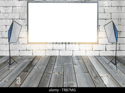 Blank billboard with with studio lights on wooden floor on brick wall Stock Photo