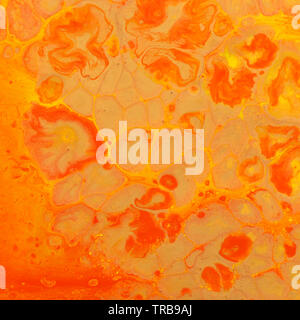 photography of abstract marbleized effect background. red and orange creative colors Stock Photo