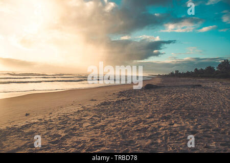 Beautiful sunset on the tropical beach with sky and clouds for travel in holiday, relax time. Sea sand sky concept, sunset colors clouds, horizon. Stock Photo