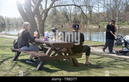 Young family having a picnic in the park. Stratford, Ontario. Stock Photo