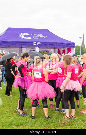 Warrington, UK. 2nd June 2019. Warrington, UK. 2nd June 2019. Race for Life 2019, Warrington, in aid of Cancer Research. A group of women stand talking in front of the Cancer Research tent prior to the start of the race Credit: John Hopkins/Ģ����ý Live News Stock Photo