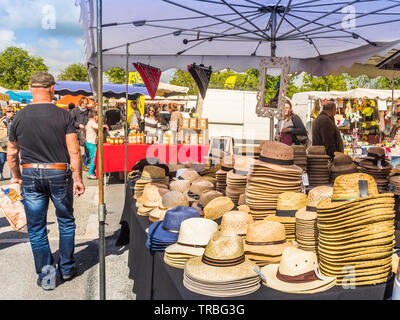 Hats for sale on market day in Les Hérolles, Vienne, France. Stock Photo
