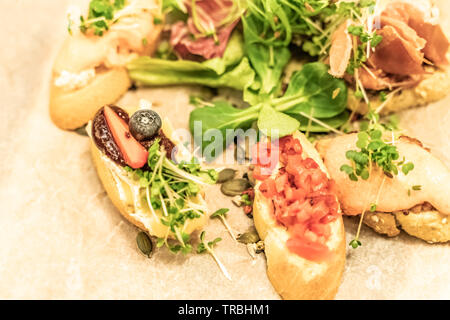Italian antipasti wine snacks set with Shallow depth of focus over dark grunge background Stock Photo