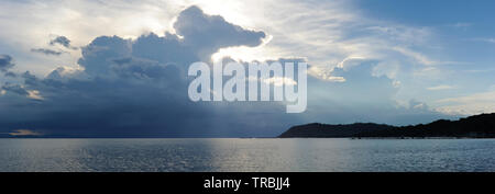 Storm over the sea. Horizontal panoramic view copy space for text on stormy cloudscape blue grey colour horizon over water during sunset, bright color Stock Photo