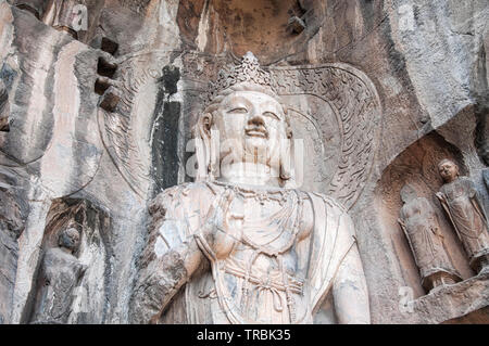 A weathered and ancient Buddha statue and carvings longmen grottoes in Luoyang China in Henan Province. Stock Photo