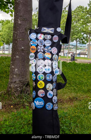 Glasgow, Scotland, UK. 24th May 2019: Different types of Pro-Scotland independence badges on a black bag. Stock Photo