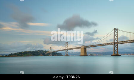 Bay Bridge is located in California, US, and connects San Francisco and Oakland. Its construction finished in 1936 and is one of the main landmarks of Stock Photo