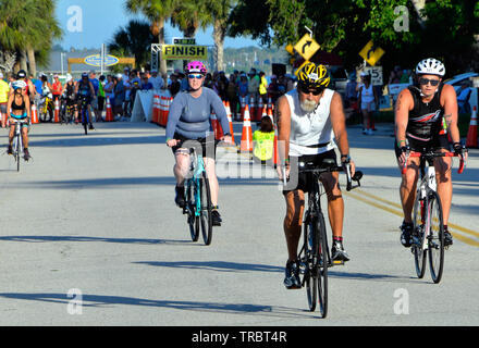 Melbourne Beach, Florida, USA. June 2, 2019 Founded in 1985 this year marks the 34th year of the Rotary Pineapple Man Triathlon.  It is the oldest USA Triathlon (USAT) sanctioned triathlon in the State of Florida. This year the number athletes was limited to around three hundred as the race has grown over the years and overwhelmed the local community. Racers completed a 0.34 mile swim in the Indian River, 15.4 miles bike ride and run the final leg of 03.4 through local streets. Photo Credit Julian Leek / Alamy Live News Stock Photo