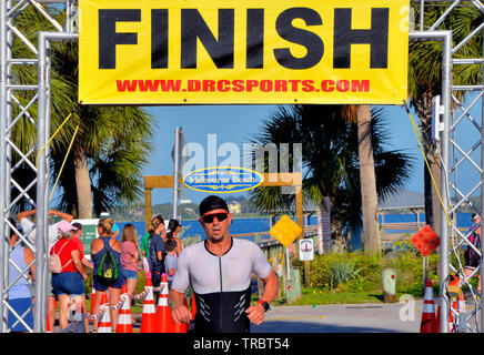 Melbourne Beach, Florida, USA. June 2, 2019 Founded in 1985 this year marks the 34th year of the Rotary Pineapple Man Triathlon.  It is the oldest USA Triathlon (USAT) sanctioned triathlon in the State of Florida. This year the number athletes was limited to around three hundred as the race has grown over the years and overwhelmed the local community. Racers completed a 0.34 mile swim in the Indian River, 15.4 miles bike ride and run the final leg of 03.4 through local streets. Photo Credit Julian Leek / Alamy Live News Stock Photo