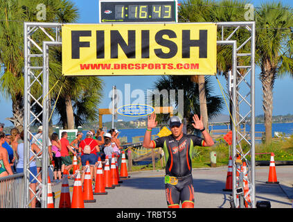 Melbourne Beach, Florida, USA. June 2, 2019 Founded in 1985 this year marks the 34th year of the Rotary Pineapple Man Triathlon.  It is the oldest USA Triathlon (USAT) sanctioned triathlon in the State of Florida. This year the number athletes was limited to around three hundred as the race has grown over the years and overwhelmed the local community. Racers completed a 0.34 mile swim in the Indian River, 15.4 miles bike ride and run the final leg of 03.4 through local streets. Photo Credit Julian Leek / Alamy Live News Stock Photo