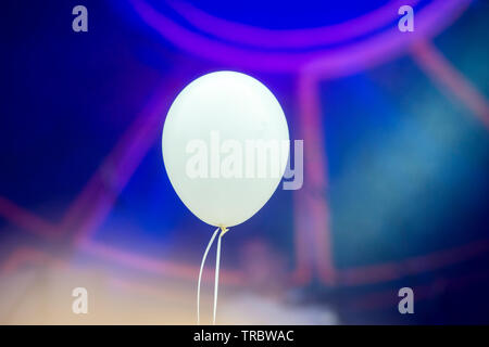 Blank White Helium Balloon on a white String Floating in Mid Air Stock Photo