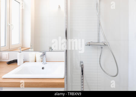 Modern bathroom equipment, details. Wise elegant solutions. White key. Stock Photo