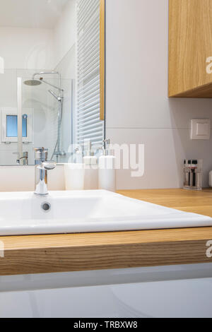 Modern bathroom equipment, details. Wise elegant solutions. White key. Stock Photo