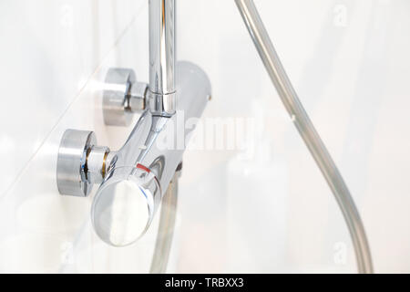 Modern bathroom equipment, details. Wise elegant solutions. White key. Stock Photo