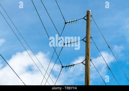 Electric power pole with insulators Stock Photo