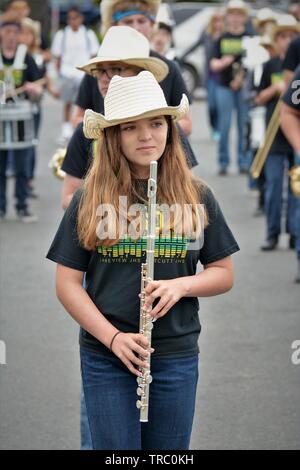 Hispanic kids who are members of California schools marching bands with instruments at Santa Maria parade Stock Photo