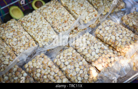 Fresh macadamia nuts peeled in package plastic bag vacuum for sale in the market Stock Photo