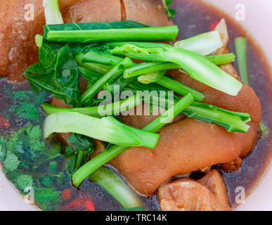 Stewed pork leg with sweet gravy sauce and chinese kale asia style food Stock Photo
