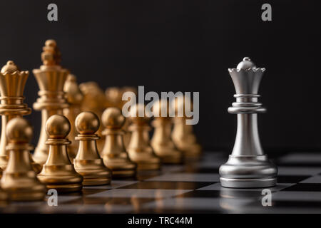 Silver queen is the leader of the golden chess in the game. Stock Photo