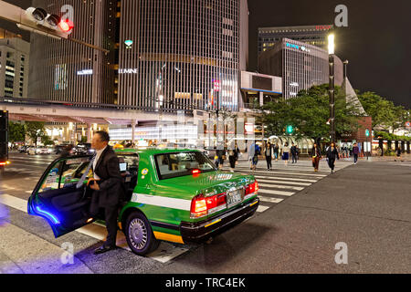 TOKYO, JAPAN, May 14, 2019 : Ginza crossing by night. The Greater Tokyo Area ranked as the most populous metropolitan area in the world. Stock Photo
