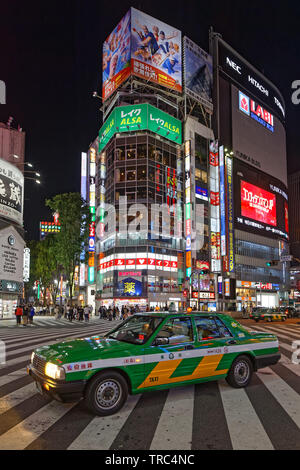 TOKYO, JAPAN, May 18, 2019 : Taxis in Shinjuku by night. The Greater Tokyo Area is ranked as the most populous metropolitan area in the world. Stock Photo