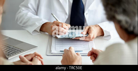 Doctor writing prescription Stock Photo